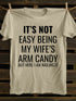 Unisex It's Not Easy Being My Wife's Arm Candy T-shirt