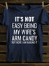 Unisex It's Not Easy Being My Wife's Arm Candy T-shirt