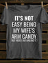 Unisex It's Not Easy Being My Wife's Arm Candy T-shirt